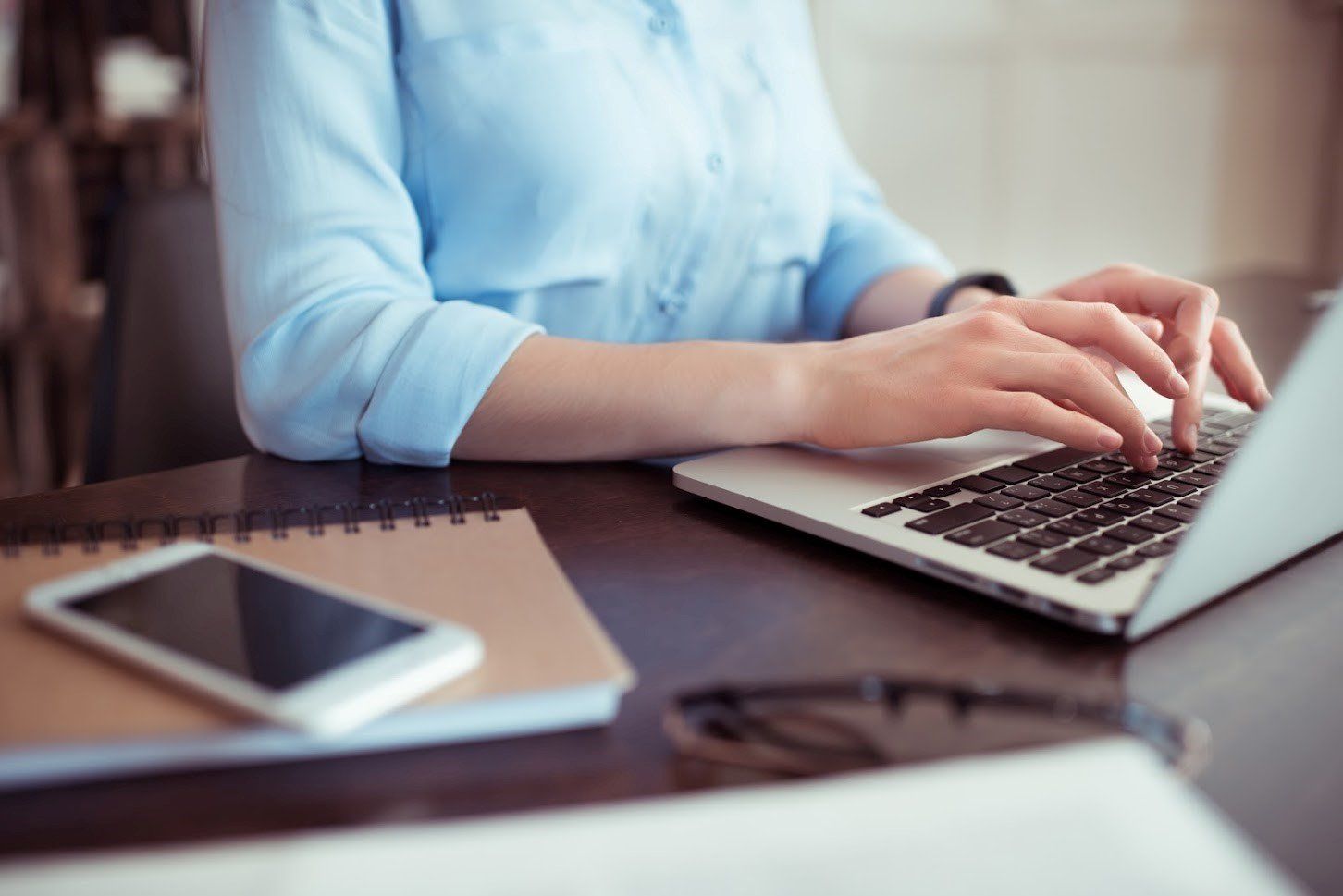 Electrical Outlets — Woman Using Her Laptop in Syracuse, NY